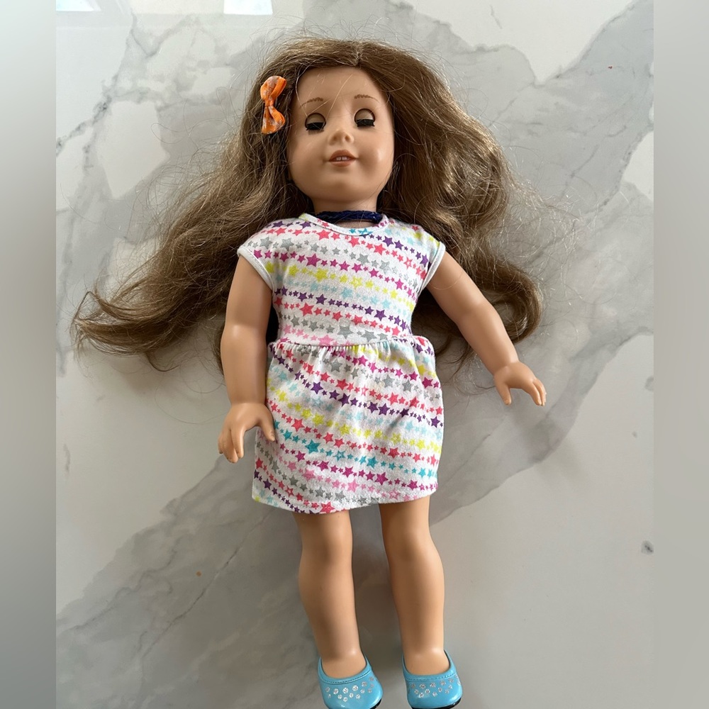 American Doll with earrings